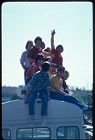 Pi Kappa Phi brothers sitting on top of a bus